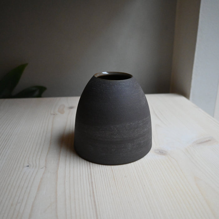 Small dark vase