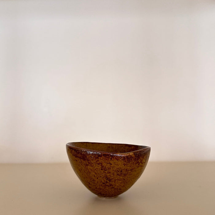 Small thumbed bowl, ochre