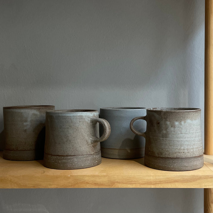 A large cup with handle, blue-gray