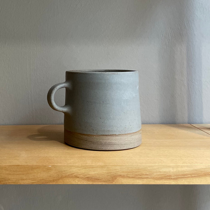 A large cup with handle, blue-gray