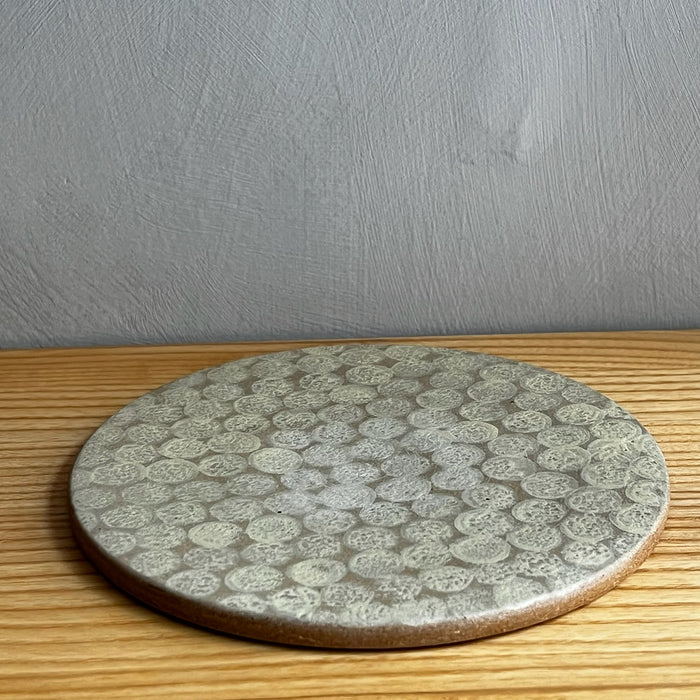 Rund mönstrad keramikplatta