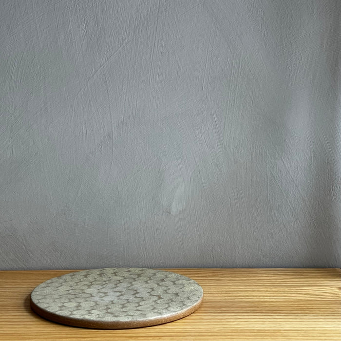 Rund mönstrad keramikplatta